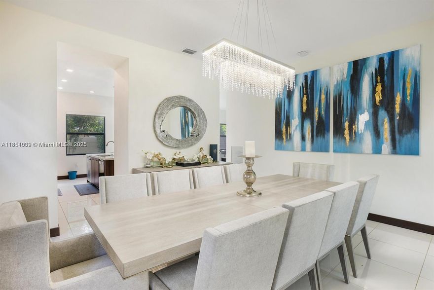Seize the Allure of Tranquility!
Step into elevated living in Miami Lakes’ exclusive Satori community. “Tranquility” is more than a SMART home—it’s a statement of style and serenity. Every detail is designed to impress, from rich wood floors and elegant chandeliers to mood-enhancing LED lighting and designer finishes.
Flooded with natural light through expansive windows and glass doors, the open layout seamlessly connects the kitchen, breakfast nook, and TV room—ideal for everyday living and family moments. The formal living and dining areas offer the perfect backdrop for sophisticated entertaining.

Outside, enjoy a fenced yard, garage, and access to resort-style amenities, including a pool, splash park, and 24/7 security.