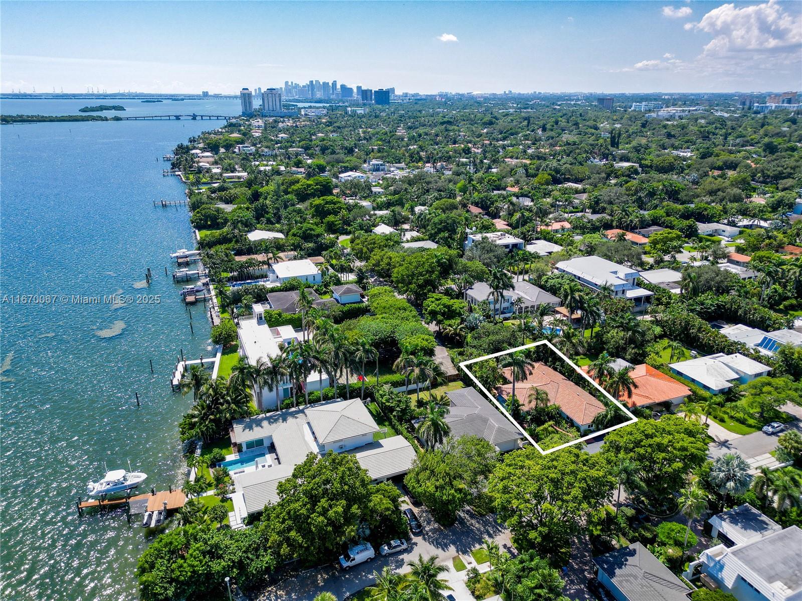 Just steps from stunning Biscayne Bay on the desirable East side of Miami Shores, this beautifully renovated Miami Shores home offers 3,156 SF of sun-filled, single-level living. Enter through a covered Terrazzo porch into a spacious layout featuring two expansive living areas and generously sized rooms with ample closet space and impact windows throughout.
This home boasts 5 BR, 4 BA + laundry room +office. The primary bath features a marble finish, jacuzzi spa tub, separate shower with 10 shower heads, and a bidet. Located just three homes from the open bay and only minutes away from the Miami Shores Golf & Community Center. Enjoy easy access to top schools, major highways, airports, the Design District, Downtown, Bal Harbour Shops, and a variety of restaurants and shopping centers.