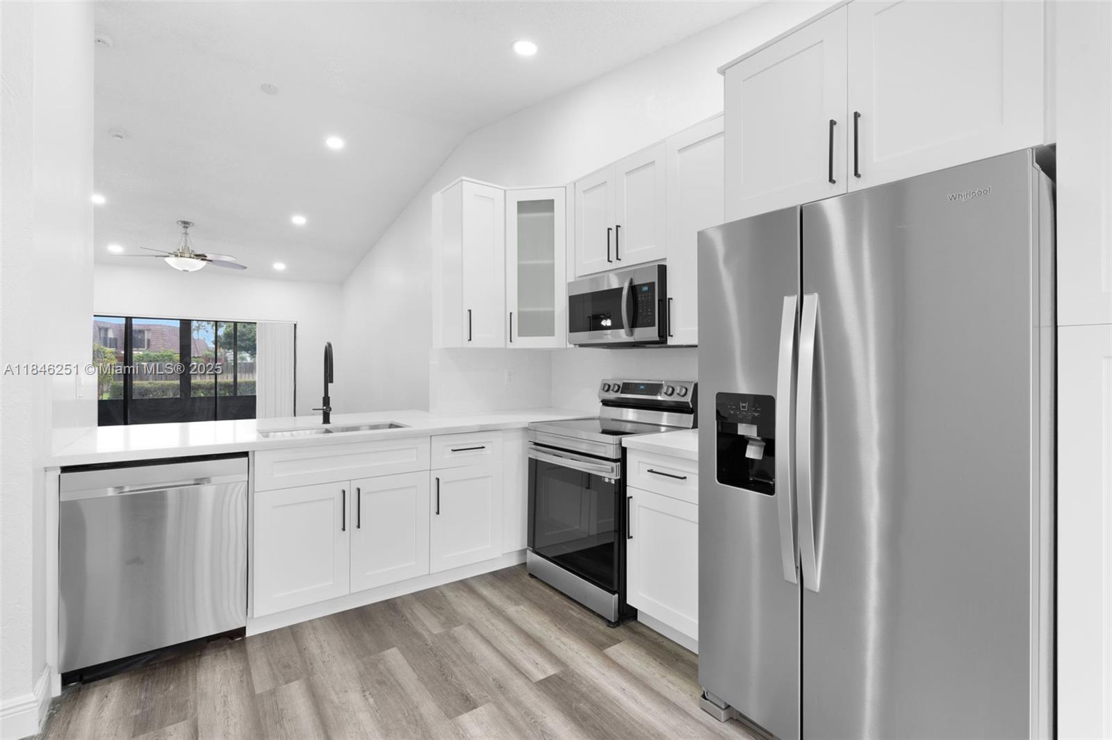 Beautifully updated 2 bedroom villa in a PRIME Deerfield location! Each bedroom has its own en suite bathroom. Enjoy a renovated kitchen with white cabinets and quartz counters, stainless steel appliances, luxury vinyl flooring, and fresh paint. Spacious living/dining area perfect for relaxing or entertaining. The large primary suite features a walk-in closet, updated bathroom vanity and stylish tiled shower. The second bedroom offers a modern bath with tub/shower combo. Need more space?? The enclosed Florida room with AC, laundry, and storage is the perfect hang out room. Step out on to the ultra private patio which is ideal for BBQs w/ tons of green space. You'll have your own private driveway that can fit up to 3 vehicles. Easy access to all major highways and shopping is close by.