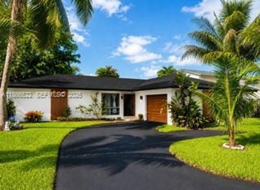 WATERFRONT HOME. OVERSIZED LOT. LOW $150 ANNUAL HOA. Close to Beaches, 2 Intl Airports, Downtown Davie, Cruise Ports, Hard Rock Stadium & less than 2 miles to Nova Southeastern Univ (NSU) and HCA Florida Univ Hospital. Spacious Home in LAKESHORE RANCHES is a Hidden Gem.  Split-plan 3 Beds, 2 Baths. Kitchen & Family Rm separated from the Living Rm & Formal Dining Rm.  Kitchen Whirlpool Energy Star appliances, Maytag Washer & Dryer, AND Plantation Shutters are included.NEW WATER HEATER OCT 2025 & AC 2023. Access your backyard 3 ways, Via Sliding doors from your Dining/Living Rm, from your Kitchen/Family Rm, AND from your PRIMARY SUITE.  Relax in your Lanai, Enjoy Water Views, Easy-care landscaping, & DAILY Fishing, Kayaking, Swimming etc.  AMAZING OPPORTUNITY.