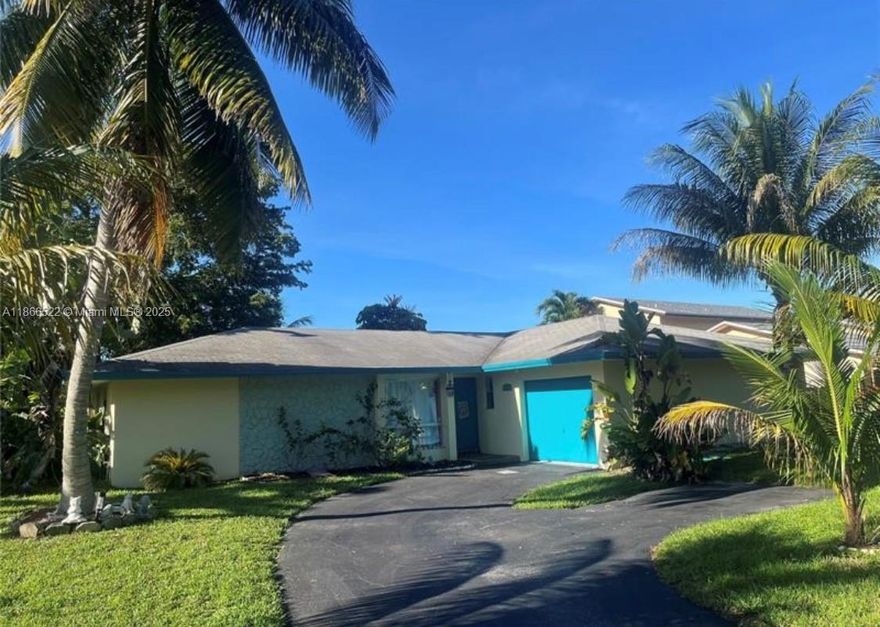 WATERFRONT HOME. OVERSIZED LOT. LOW $150 ANNUAL HOA. Close to Beaches, 2 Intl Airports, Downtown Davie, Cruise Ports, Hard Rock Stadium & less than 2 miles to Nova Southeastern Univ (NSU) and HCA Florida Univ Hospital. Spacious Home in LAKESHORE RANCHES is a Hidden Gem.  Split-plan 3 Beds, 2 Baths. Kitchen & Family Rm separated from the Living Rm & Formal Dining Rm.  Kitchen Whirlpool Energy Star appliances, Maytag Washer & Dryer, AND Plantation Shutters are included.NEW WATER HEATER OCT 2025 & AC 2023. Access your backyard 3 ways, Via Sliding doors from your Dining/Living Rm, from your Kitchen/Family Rm, AND from your PRIMARY SUITE.  Relax in your Lanai, Enjoy Water Views, Easy-care landscaping, & DAILY Fishing, Kayaking, Swimming etc.  AMAZING OPPORTUNITY.