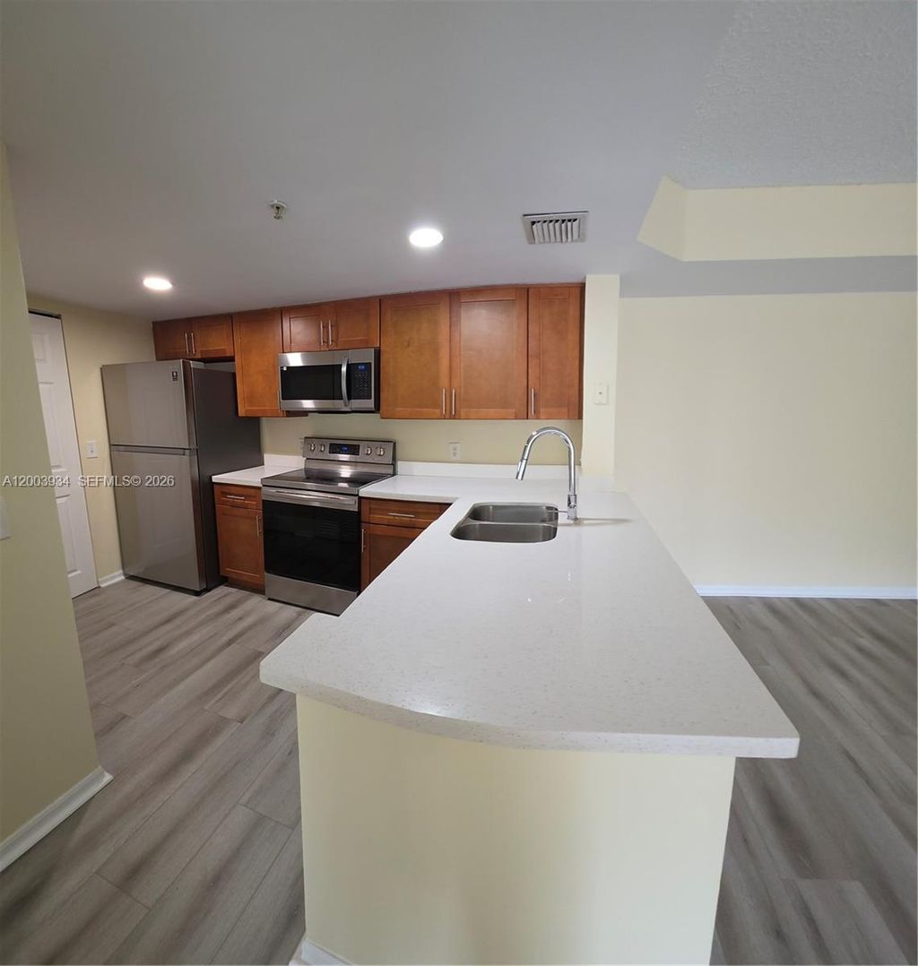 Photo of 5051 Wiles Rd #201, Coconut Creek, FL 33073 (MLS # A12003934)