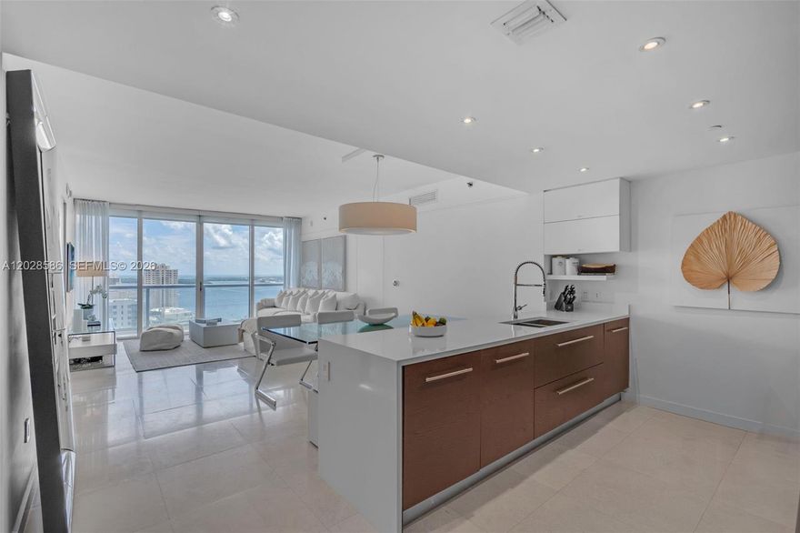 Sophisticated furnished residence at Icon Brickell Tower 1. This beautifully curated 2 bedroom, 2 bathroom + den residence offers a refined blend of design, comfort, and functionality. Unlike the standard floor plan, the open den has been thoughtfully enhanced with custom built cabinetry, creating a more defined and versatile living space. Features include a custom pantry, elegant light flooring, floor to ceiling impact glass, and abundant natural light throughout. The open kitchen is equipped with premium appliances and seamlessly connects to spacious living and dining areas. Enjoy beautiful city and water views from a private terrace. Offered furnished, this residence presents a rare turnkey opportunity in one of Miami’s most sought after addresses. Icon Brickell residents enjoy world class amenities including a renowned spa and fitness center, resort style pool deck, valet, concierge, restaurants, and an unbeatable Brickell waterfront location near Brickell City Centre, dining, shopping, and entertainment.