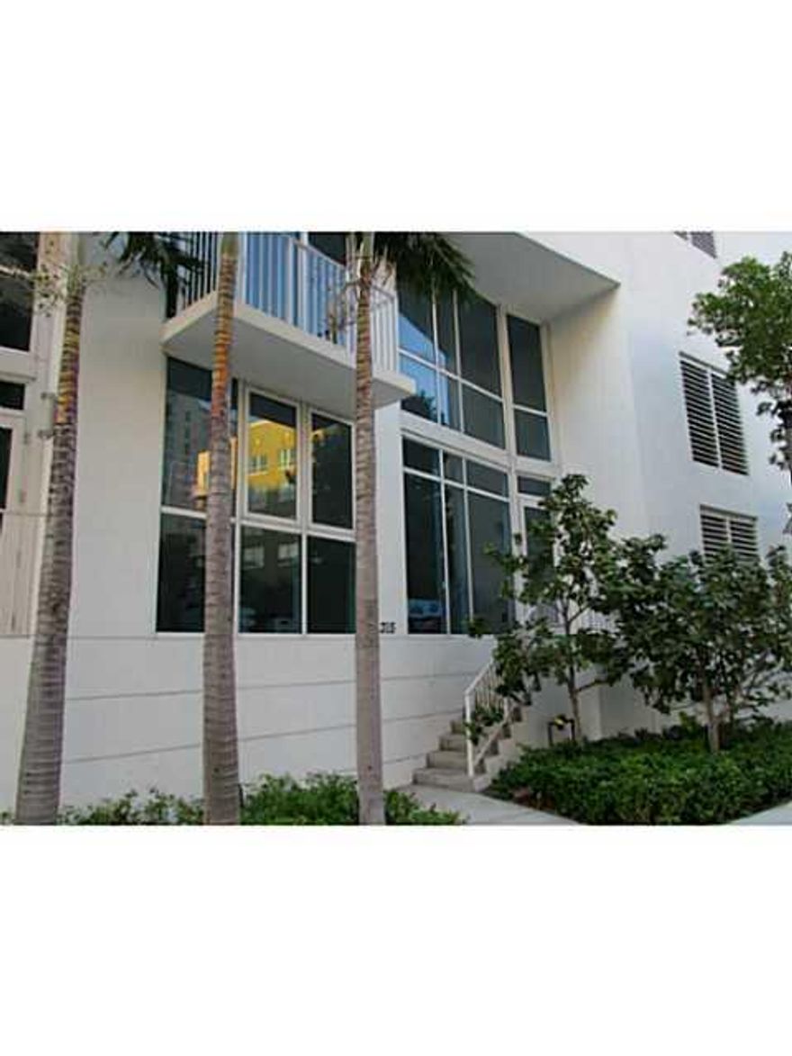 PERFECT BLEND OF AUTONOMOUS TOWNHOUSE LIVING IN COMFORTABLE LUXURY.TWO STORY W/20+ FOOT LIVING ROOM CEILINGS. 1 BDRM/1 BATH ON EACH LEVEL.LOFT BALCONY SERVES AS DEN. MASTER W/WALK IN CLOSET AND BALCONY.SUBZERO WOLFE APPLIANCES, WINE CHILLER. FULL WASHER/D RYER. TILED FLOORS, AFRICAN MAHOGANY STAIRS. 2 POOLS, CABANAS, BBQ, MOVIES, POOL TABLE, SPA, GYM. WALK TO MARGRET PACE PARK, RESTAURANTS, OPERA, PERFORMING ARTS.SURROUNDED BY DOWNTOWN, WYNWOOD,DESIGN DIST, MINUTES TO THE BEACH OR AIRPORT.