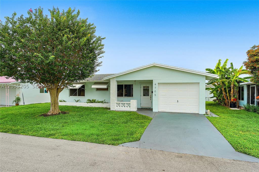 Photo of 4705 NW 43rd Ave, Tamarac, FL 33319 (MLS # A12035205)