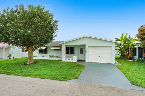 Photo of 4705 NW 43rd Ave, Tamarac, FL 33319 (MLS # A12035205)