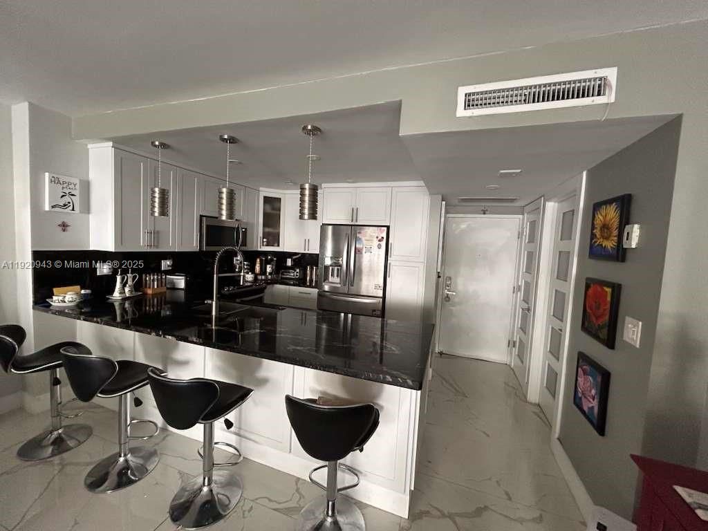 Photo of 3725 S Ocean Dr #1103, Hollywood, FL 33019 (MLS # A11920943)