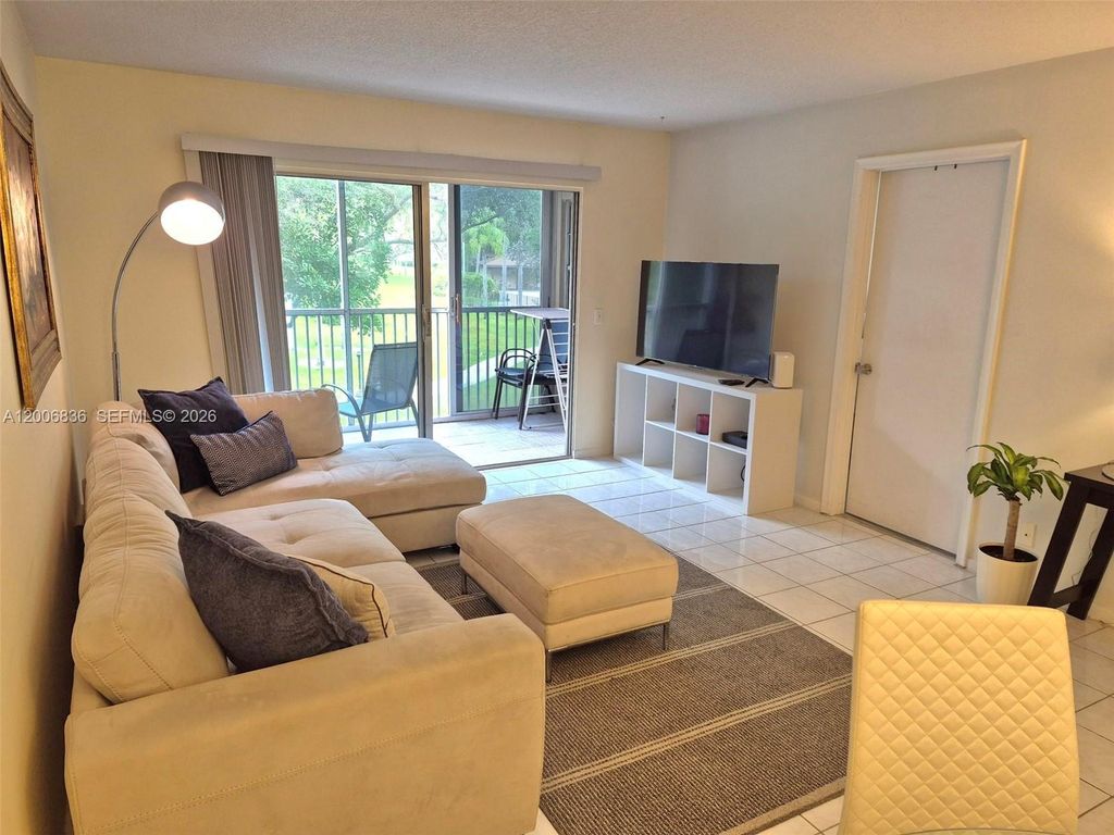 Photo of 12501 SW 14th St #209R, Pembroke Pines, FL 33027 (MLS # A12006836)