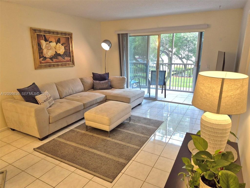 Photo of 12501 SW 14th St #209R, Pembroke Pines, FL 33027 (MLS # A12006836)