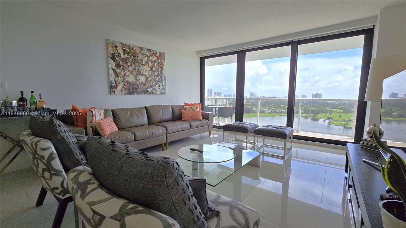 Discover a true gem in Flamenco Towers with this impeccably remodeled 2Bd/2Bth unit. Every detail has been thoughtfully crafted, from the hurricane-impact windows with electric blinds to the elegant porcelain tile flooring. The kitchen boasts wood cabinets, granite countertops, and stainless steel appliances, while the modern bathrooms feature stylish bidet accessories. Tasteful furnishings and a stunning view of the Aventura Turnberry PGA golf course complete this exceptional home. Enjoy serene golf and city vistas from your private balcony. Just a short walk from shops and dining options, including the world-renowned Aventura Mall. Recent building upgrades include a new lobby, refreshed hallways, and updated social areas. Don’t miss it!