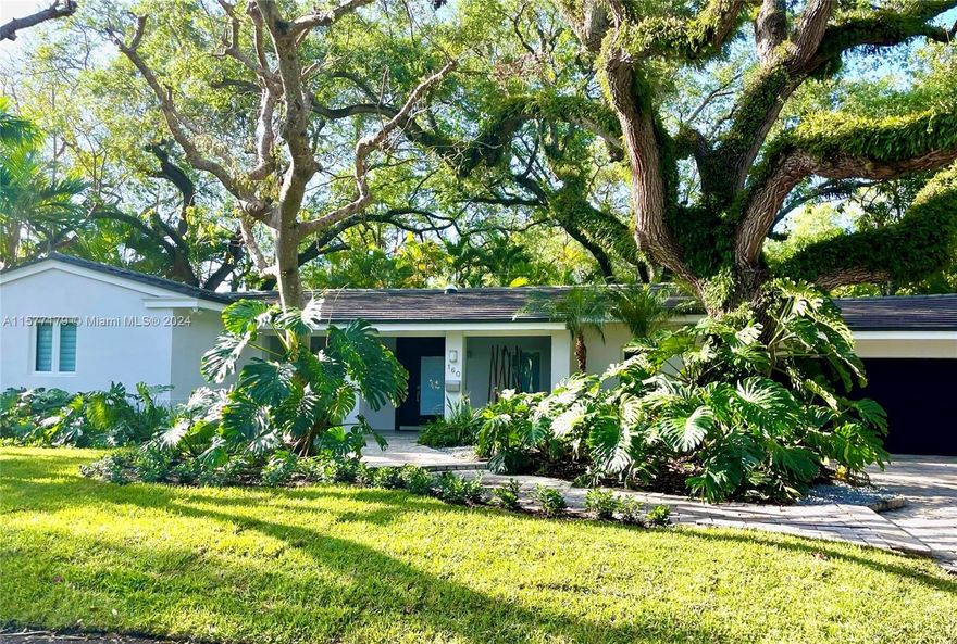 Towering oaks frame this Asian inspired perfect "10", completely updated with travertine marble and hardwood floors, impact windows throughout and high ceilings. Many great features include ultra-slick kitchen featured in a design magazine w/ breakfast area and white quartz counters, indoor laundry room, quality window treatments. Newer pool and stone deck with lush landscaping in a private setting. Large master closet and a spacious two car garage.  *** See Broker Remarks for Showing Instructions ***