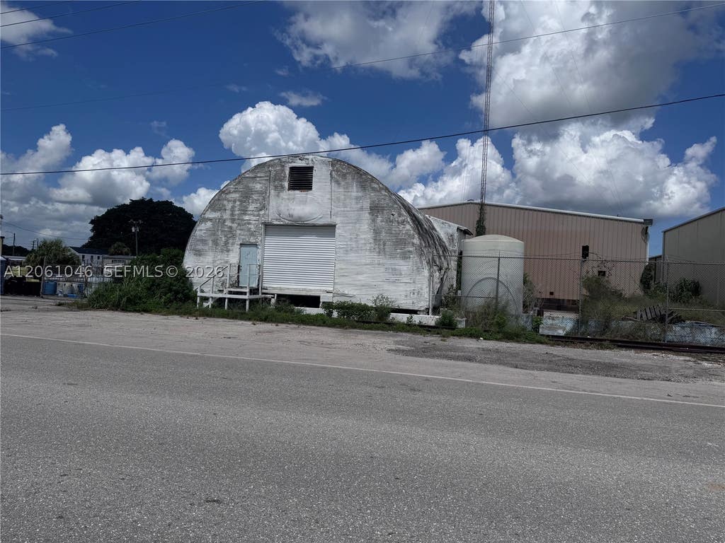 Photo of 909 NW 13th St, Belle Glade, FL 33430 (MLS # A12061046)