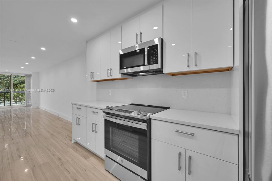 Beautifully renovated, turn-key condo featuring in-unit washer and dryer connections. The home offers a brand-new kitchen with all new appliances, fully updated bathrooms, and modern dropped ceilings with recessed LED lighting throughout. It includes new porcelain wood-look flooring, an enclosed patio with custom impact windows, frosted interior glass doors, a newer AC and electrical panel, and a new water heater. Everything has been thoughtfully upgraded for comfort and convenience.