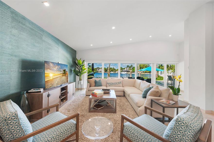 Introducing Floridays of Surfside, a beautiful waterfront pool home ideally situated on Point Lake with 50ft of water frontage, new sea wall and boat dock with no bridges to the ocean. This updated 1-story 4-Bed/3.5-Bath home features several new big-ticket items including a new metal roof, solar panels, outdoor kitchen appliances, patio flooring and pool resurfacing. This home boasts a large primary suite, eat-in kitchen with Chef's island and an open-concept living/dining room that seamlessly leads to an expansive covered patio with summer kitchen and dining area overlooking the waterfront pool. This Surfside home is ideally located walking distance from the beach and just minutes from the world-renowned Bal Harbour Shops and an array of entertainment in Miami Beach.