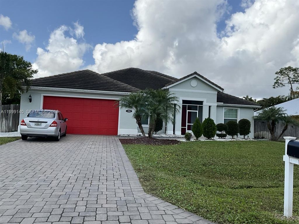 Photo of 898 SW Curtis St, Port St Lucie, FL 34983 (MLS # A11999140)