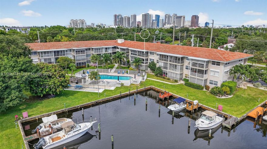 TOTALLY UPGRADED! Top-floor unit w/ SCREENED PATIO w/ WATER VIEWS & pool views, nestled within a boutique SECURE / GATED community w/ cameras. Kitchen w/ updated cabinets, stainless appliances, granite counters & a breakfast counter. Primary bathroom w/ modern upgraded shower & vanity & backlit mirror. 2023 ROOF, Hurricane-IMPACT WINDOWS, 2022 AC, newer Electric Panel, walk-in closet, laminate floors in main area & thoughtful SPLIT BEDROOM floor plan. Pool, small gym, exercise paths. Pet-friendly w/ restrictions, conveniently located parking space & private STORAGE AREA. Enjoy close proximity to highways, beaches, the airport, Port Everglades and downtown. Plus, the building’s 40 year & 50 inspections are complete, w/ RESERVES! No rentals so the building is nice and QUIET. Amazing Location Just off i95 - mins to the Port, Airport, Downtown & BEACH. There may be about 4-5 BOAT DOCK RENTAL SLIPS available now - NO FIXED BRIDGES TO OCEAn. Negotiable from owner to owner - check bulletin board in mail room.