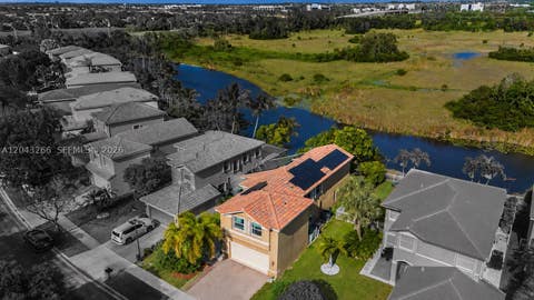 Photo of 1941 SW 148th Way, Miramar, FL 33027 (MLS # A12043266)