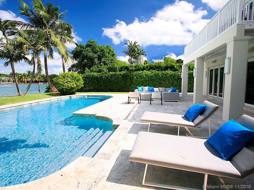 Completely renovated and perfectly laid out home with magnificent wide water views offering 4 large en-suite bedrooms plus spacious attached guest apartment. Classically decorated using timeless finishes such as carrara and black savoie marble countertops, dark oak wide plank flooring and stunning vein cut unpolished marble tiling. Features include large master terrace, multi-room audio system, lutron lighting, poolside cabana bathroom, 2-car garage, and a dock. Great central location.