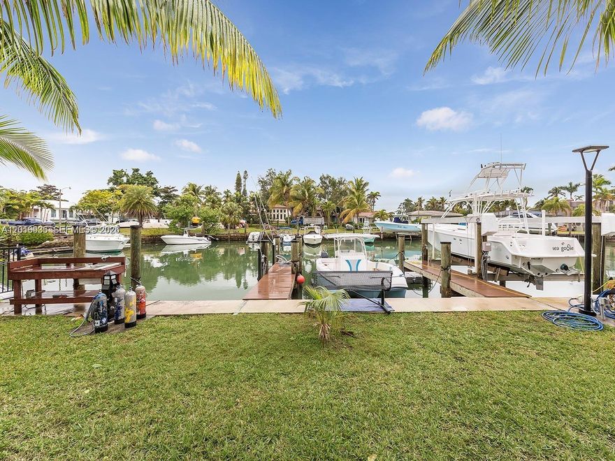 Timeless 1930s waterfront charm meets modern comfort in Miami's desirable Belmar neighborhood. This 4BR/3BA home features a detached 1BD/1BA cottage — ideal for extended family, guests, home office, or studio. Inside enjoy Italian cabinetry, stainless appliances, and beautiful hardwood floors. Step outside to unique front-of-home dockage with direct Bay and ocean access, a fully fenced yard with secure fencing throughout. Golf lovers are 5 minutes from Miami Shores Country Club. Top schools nearby include Miami Country Day, The Cushman School, and St. Rose of Lima. Minutes to premier shopping at Bal Harbour & Aventura, sandy beaches, Downtown Miami, and South Beach.