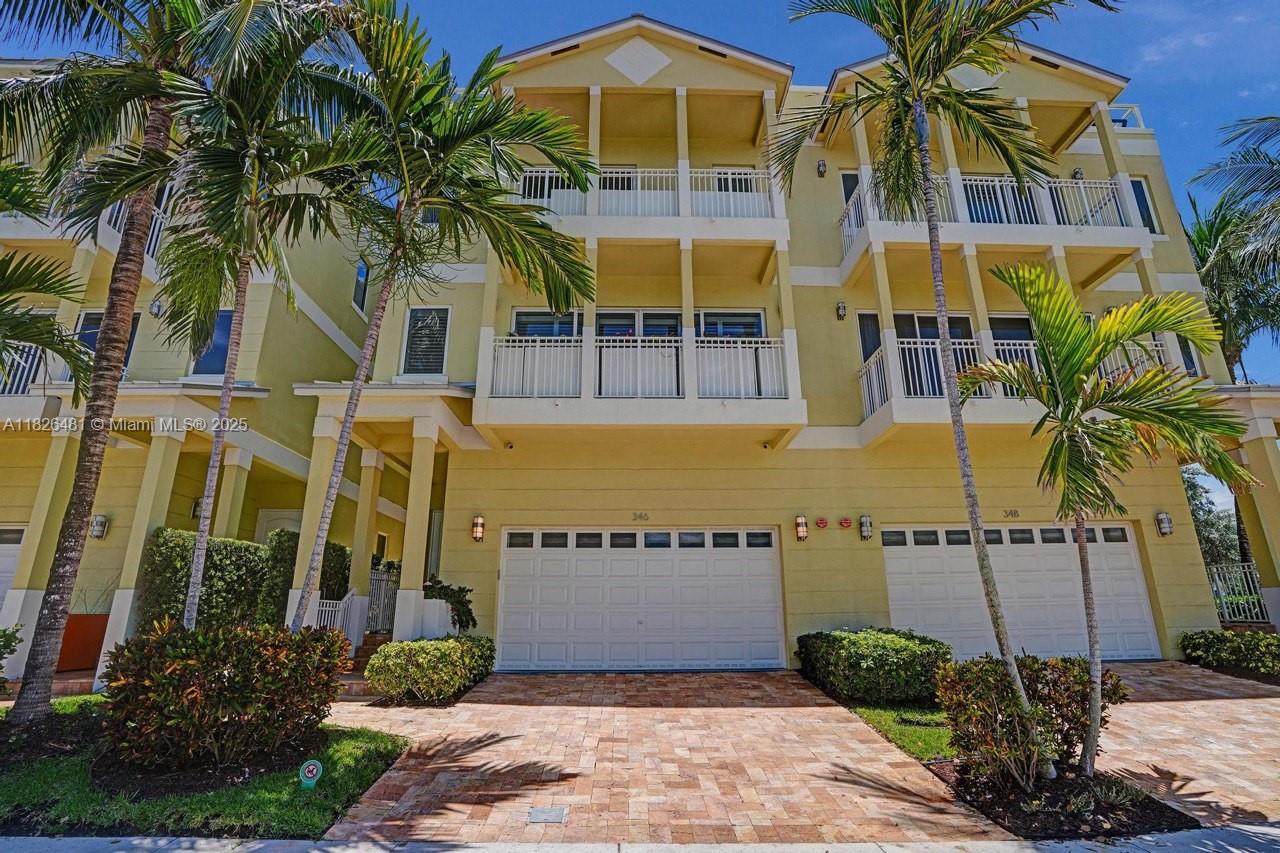Just steps from the beach, this 3 bed + open den (easily convertible to 4th bed) / 4 bath smart townhome offers luxury living with ocean & intracoastal views from the rooftop terrace. Gourmet white kitchen features granite counters, Sub-Zero fridge, Wolf appliances & oversized island. Includes 3 en-suite bedrooms: a spacious primary suite with balcony, a second en-suite on the 3rd floor serving as a second primary, and a guest suite with full bath on the ground floor. Elevator, impact windows, 2-car garage. Lutron Caseta wireless dimmers, Alexa-enabled lighting, Nest thermostats, Ethernet-ready, and seamless wireless connectivity throughout—including rooftop with Hot Springs heated saltwater spa. Built in 2013 & impeccably maintained.