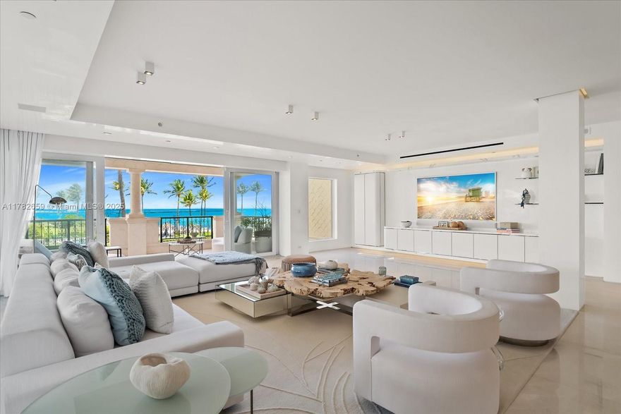 This stunning Oceanside unit on Fisher Island redefines luxury living at its finest. Completely renovated to perfection this masterpiece encompasses 3,580 sq. ft. interior, 4 bedrooms + den, 3.5 baths, wrap-around terraces overlooking the ocean, beach & golf course. Professionally designed with an open layout, state-of-the-art eat-in kitchen w/waterfall Calacatta marble counters & walls, Gaggenau & Miele appliances, separate kitchen room, custom built-in/entertainment, Osso marble floors and English oak wood floors, Venetian plastered walls, principal spa shower with chromo-light therapy, Ornare closets, impact glass doors, Savant Smart Home, Automation system w/audio-visual Stealth and more features. Live the Fisher Island lifestyle in this exceptional unit!