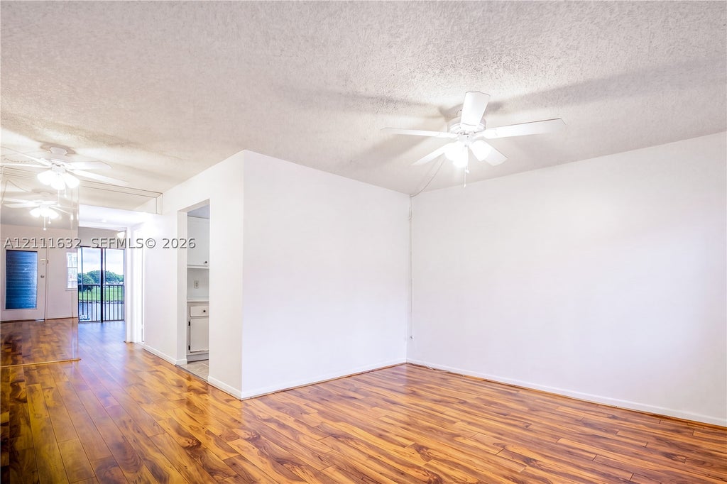 Photo of 13450 SW 3rd St #310D, Pembroke Pines, FL 33027 (MLS # A12111632)