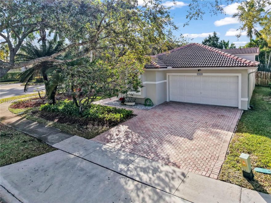 Beautiful Single Family Home on a desirable corner lot in the sought-after Pembroke Lakes area of Pembroke Pines. Features include a 5-year-old roof, impact windows and doors, and a fully fenced backyard with fruit trees (Avocado and Coconut), ideal for living and privacy.  Located in Pembroke Isles, a gated, resort-style community with 24-hour security and top A-rated schools. Enjoy unmatched amenities: a clubhouse, gym, sauna, tennis, racquetball, basketball, soccer, volleyball, 3 pools, a beach, a pier, picnic areas, and 2 playgrounds.  HOA includes security, landscaping, AT&T cable, internet, and alarm monitoring. OK to lease. Convenient to I-75, shopping, and schools. Don’t miss this opportunity!
