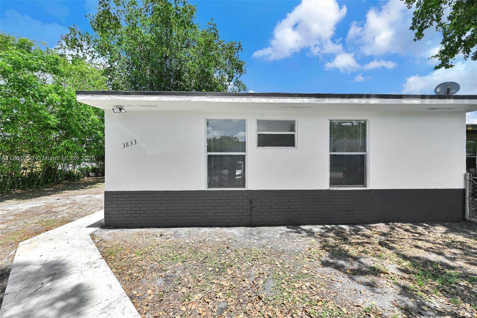 Awesome corner unit townhome with NO HOA! Property has a great backyard with a good amount of space for future pergola or for entertaining the family. PVC plumbing, tile floors, and move-in ready will not disappoint! Down the street from Hard Rock Stadium and close to Major Expressways!