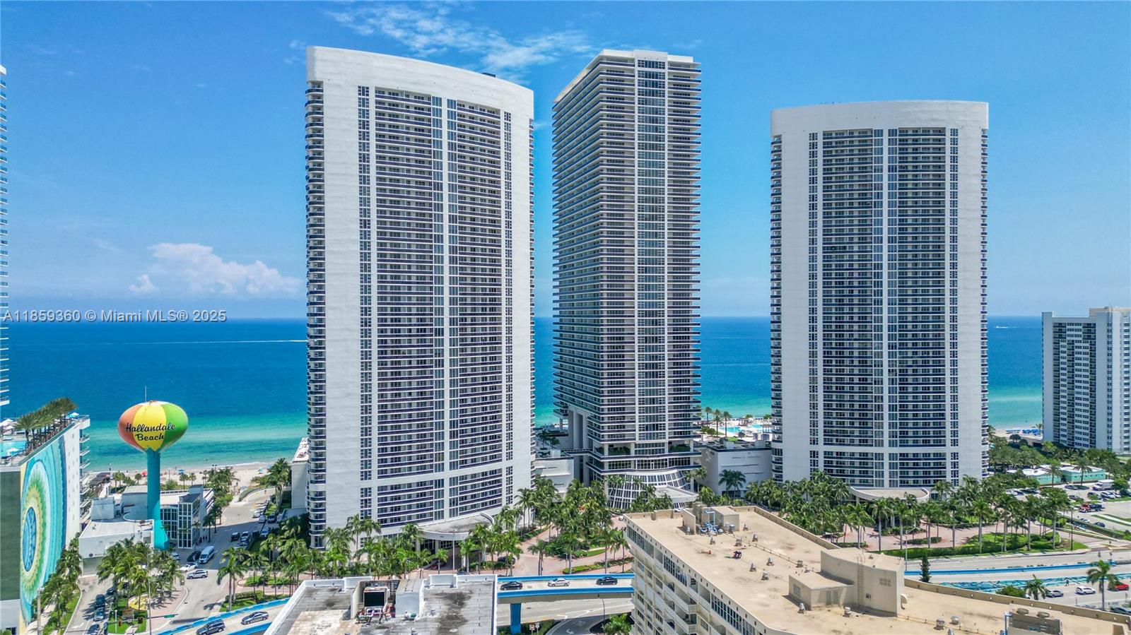 Soaring 45 stories above Hallandale Beach, this impeccably decorated 2-bedroom + enclosed den, 2-bath residence offers a 264 sq.ft. balcony with panoramic ocean and Intracoastal views. Elegance abounds with marble floors, custom wood doors, built-in closets, and a European-style kitchen with premium appliances and granite countertops. Indulge in The Beach Club’s world-class amenities: concierge, valet, beach service, six pools, bar, restaurant, and a 50,000 sq.ft. oceanfront spa and fitness center. Ideally located near Gulfstream Park, Hollywood Boardwalk, Bal Harbour, South Beach, and Las Olas.
