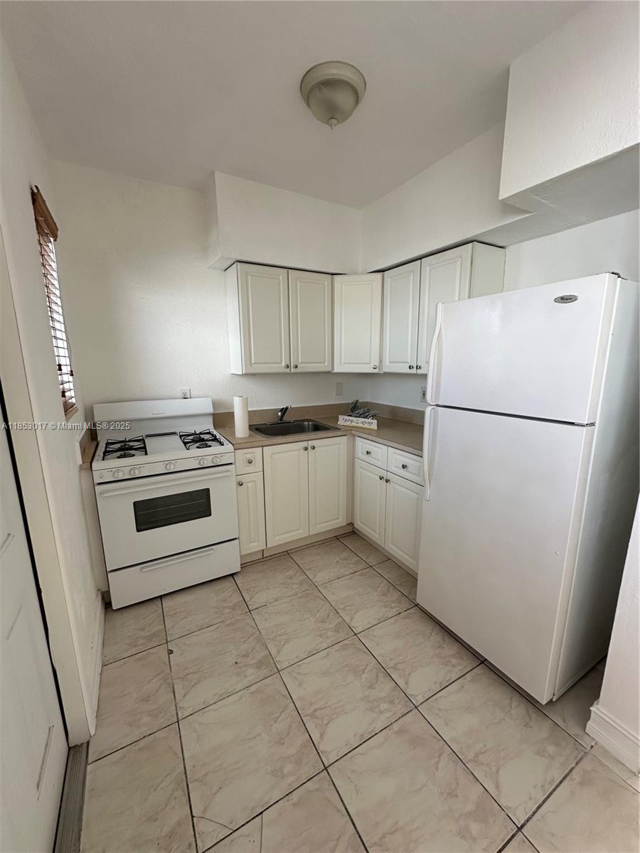 Welcome to this charming 1-bedroom, 1-bathroom condo located at 350 75th St in the vibrant city of Miami Beach. This 740-square-foot unit is part of a serene lowrise building, offering a cozy and intimate living experience just a few minutes away from the ocean.
The bedroom provides with ample closet space. The bathroom is conveniently situated, ensuring privacy.
This condo is ideally situated to enjoy all the amenities Miami Beach has to offer, from pristine beaches to an array of dining and entertainment options.
