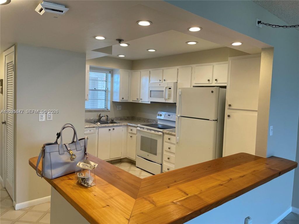 Photo of 3100 W Rolling Hills Cir #502, Davie, FL 33328 (MLS # A12025677)