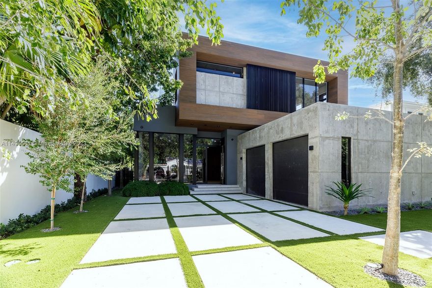 Modern new 6-bedroom, 5.5-bathroom gated home that blends comfortably with Coconut Grove’s lush landscape. Panoramic windows and natural light create a warmth that is only enhanced by the exposed concrete, wood, and stone finishes throughout the home. A sliding glass wall leads to a spacious patio, summer kitchen and beautiful pool, with steppingstones and a sundeck bench providing a seamless flow between indoor and outdoor living. Kitchen is by Mia Cucina, with quartz countertops, walk-in pantry, and appliances by Sub Zero and Wolf. Top-of-the-line smart technology from Control4, and two-car garage. Within minutes to Cocowalk and David Kennedy Park, easy commute into Brickell.