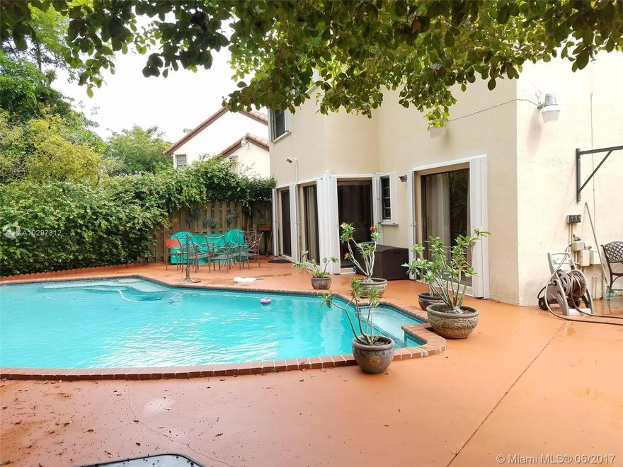 Very well maintained and ready to move in spacious and bright 2 story 3 bed garage. **One of the biggest lot in the complex**. Enjoy the beautiful pool and family. Lots of amenities included in the low maintenance fee of only $70 per pool, jacuzzi, tennis court, gym, security and green areas maintenance. Floor type, Travertine 1st floor and solid hardwood Oak stairs an 2nd floor, Hurricane accordion shutters in all windows, 4 cars driveway  Give me a call