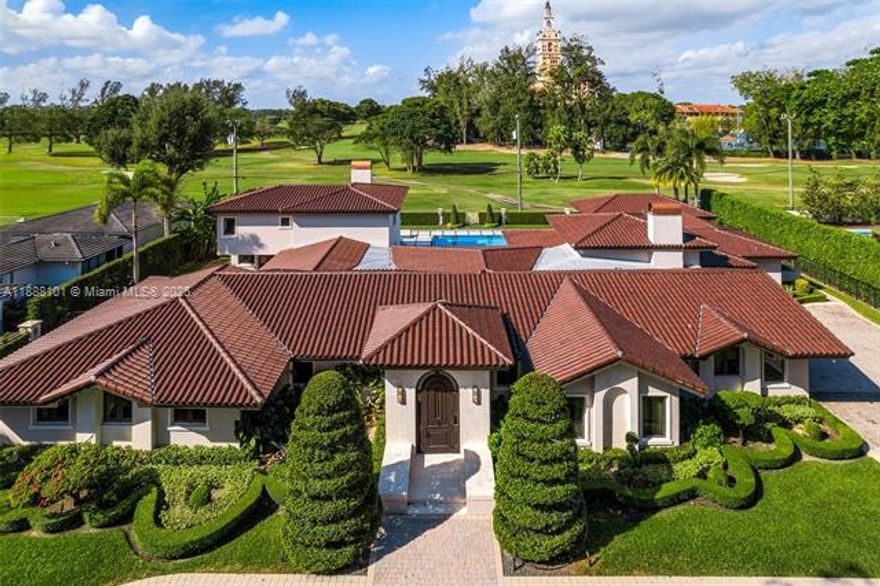 Impressive 6-bedroom, 5.5-bathroom Coral Gables estate in the desirable Golden Triangle area, overlooking the
Biltmore Golf Course. Blending timeless architecture with luxurious indoor and outdoor living, a grand foyer with
exposed wood beam ceilings leads to elegant living and dining spaces, Brazilian wood floors and golf course views.
The chef’s kitchen is equipped with a bespoke La Cornue range, marble countertops, and butler’s pantry. Upstairs,
the serene primary suite offers sweeping fairway vistas. And outdoors, enjoy a saltwater infinity pool, heated spa,
summer kitchen, lush landscaping, and custom-designed entertaining areas. Close to upscale dining, premier
shopping, and top schools.