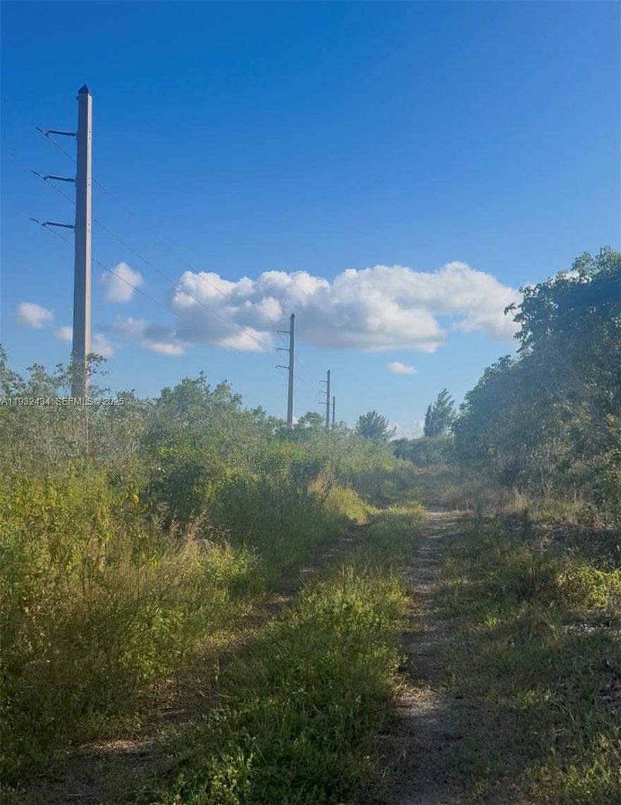 5± acres of raw land in the extreme southeastern area of Miami-Dade County.
Property is landlocked with no legal access and no utilities. Located outside the Urban Development Boundary (UDB) and zoned Interim – Awaiting Specific Zoning, allowing limited uses subject to county approval.

Ideal for long-term investment, land banking, mitigation, or conservation use. USDA, Conventional, Cash, and alternative financing may be considered, subject to lender approval. Buyer to perform all due diligence regarding access, zoning, environmental restrictions, and permitted uses.