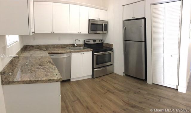 Centrally located blocks from Biscayne, completely remodeled 4/2, new roof, all new impact doors & windows, wood floors throughout, and porcelain tile in bathrooms. Alarm system, fully fenced, and designer landscaping. All new plumbing, electrical, A/C system. Wood kitchen cabinets with granite countertops.