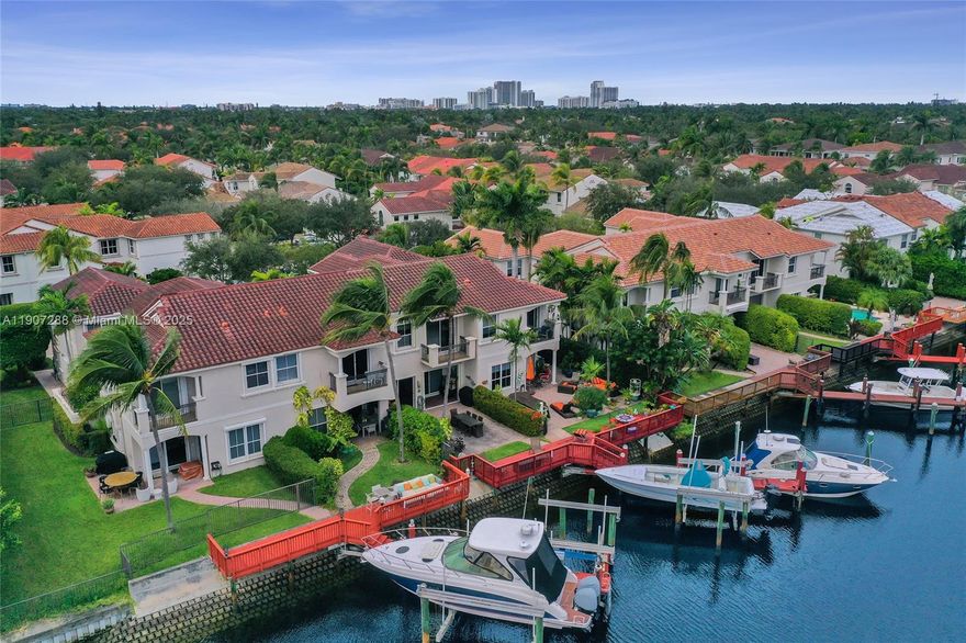 Waterfront-Direct Ocean Access. Located in prestigious gated community of Harbor Islands - This 3-bedroom 2.5 bath waterfront home is the best waterfront value in South Florida. Relax on the large waterfront patio with 37’private dock and lift & no fixed bridges to the ocean. Bright and open feeling. Water view balcony off the master bedroom. This is a premium waterfront location.  All landscaping is maintained by the association so you can enjoy the amenities like the on-site health spa, full-service marina, lighted tennis, pickleball & basketball courts or take a walk in the community’s 20-acre park.