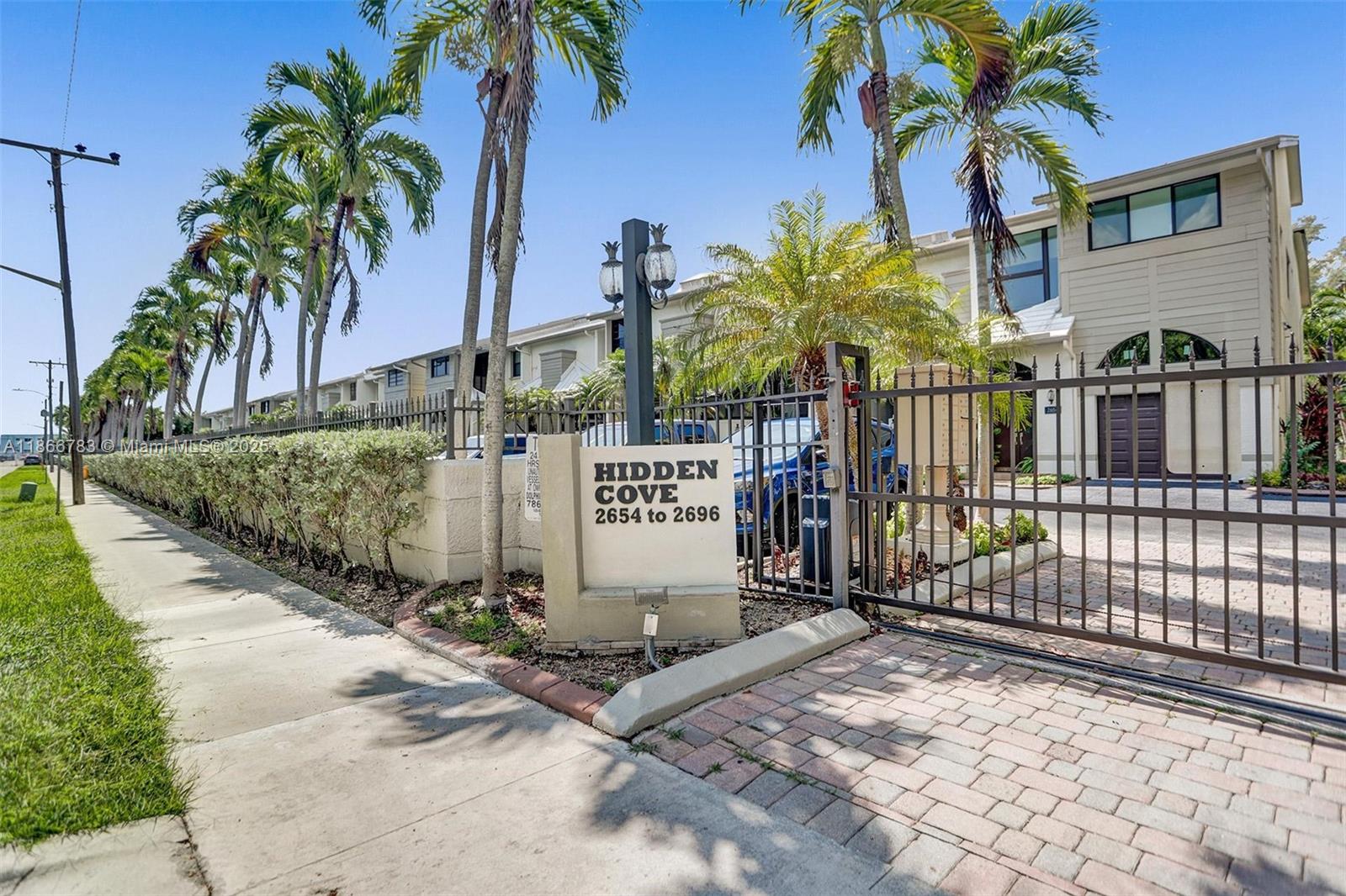 Discover the enchanting "Hidden" Cove, a gated waterfront community featuring just 21 exquisite townhomes. This updated unit boasts custom hardwood kitchen cabinets, granite countertops, breakfast nook, and wet mini bar, along with convenience amenities like a washer and dryer on the second floor. With two luxurious master suites and an additional full bathroom on the first floor, this home offers comfort and functionality. Enjoy immediate ocean access in your kayak or paddle board, and relish breathtaking sunrises and sunsets from your waterfront deck. Keystone Point Marina and TNT Marina are steps away to store a vessel.