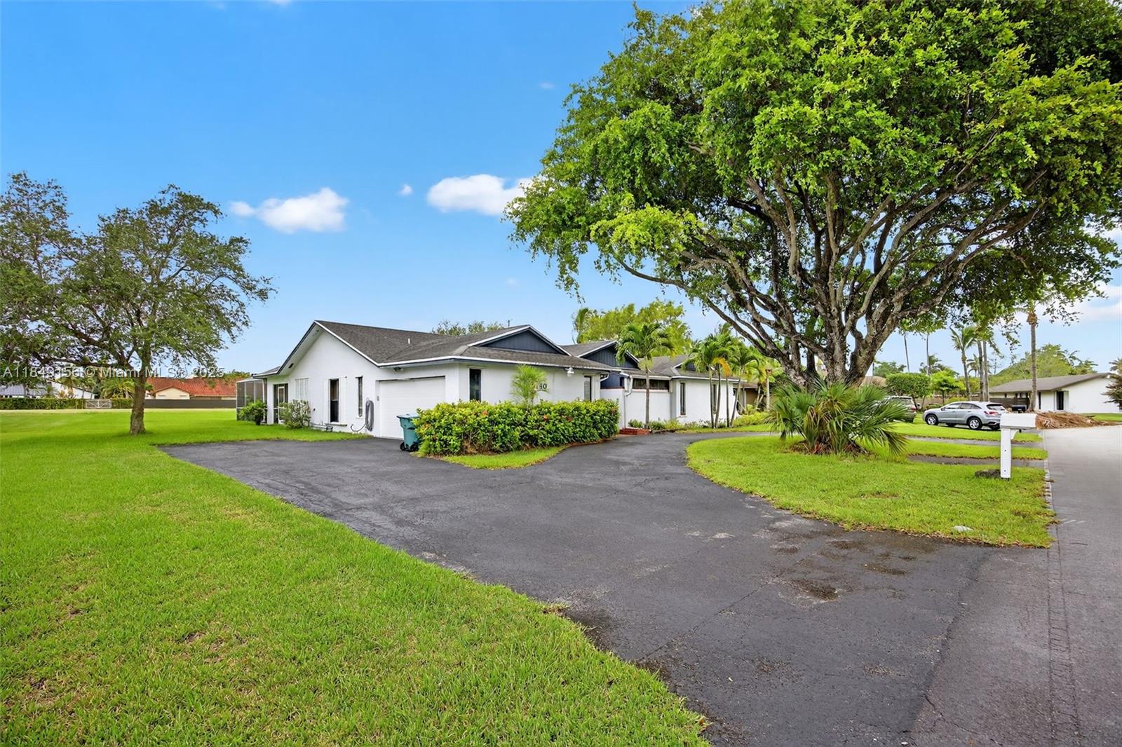 Welcome to this amazing 4 bed, 3 bath home with a large den, ideally located just moments from The Falls Shopping Center! Situated on a spacious canal-front lot, this property offers over 2,700 sqft of living space with a screened pool and patio, perfect for entertaining or relaxing in privacy. Inside, you'll find a well-laid-out floor plan featuring a large living area and a versatile den that can easily serve as a home office, gym, or guest room. Enjoy the unbeatable location less than a mile from Publix, YMCA, golf course, restaurants, movie theater, and more. Whether you're looking for your forever home or an investment with incredible upside, this property checks all the boxes. Don’t miss your chance to own in one of the most desirable neighborhoods!