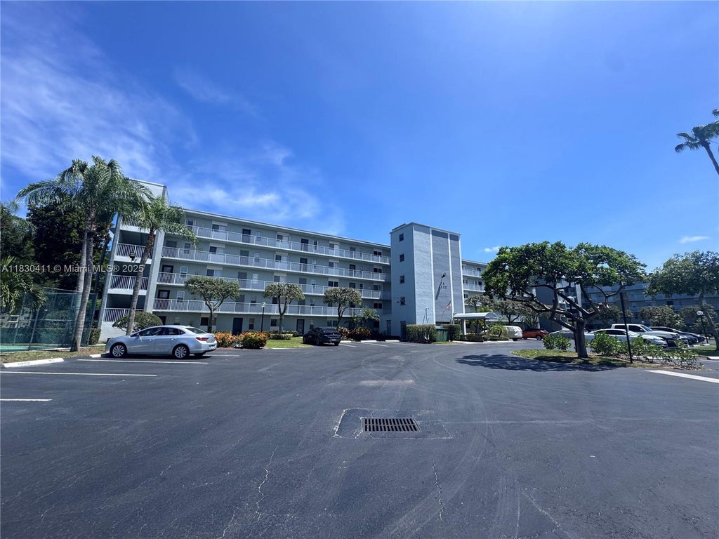 Photo of 2228 N Cypress Bend Dr #407, Pompano Beach, FL 33069 (MLS # A11830411)