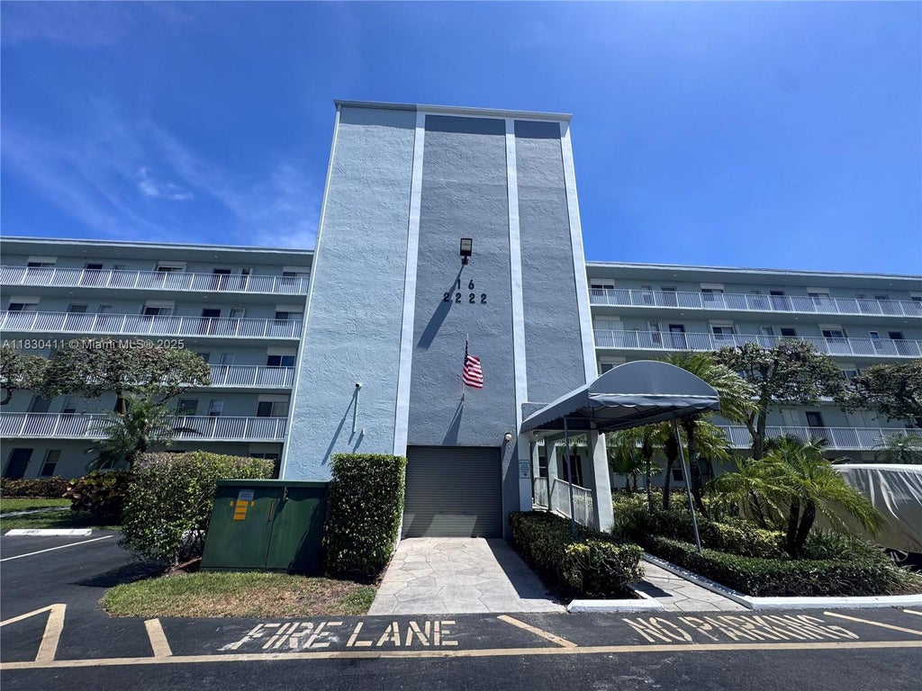 Photo of 2228 N Cypress Bend Dr #407, Pompano Beach, FL 33069 (MLS # A11830411)