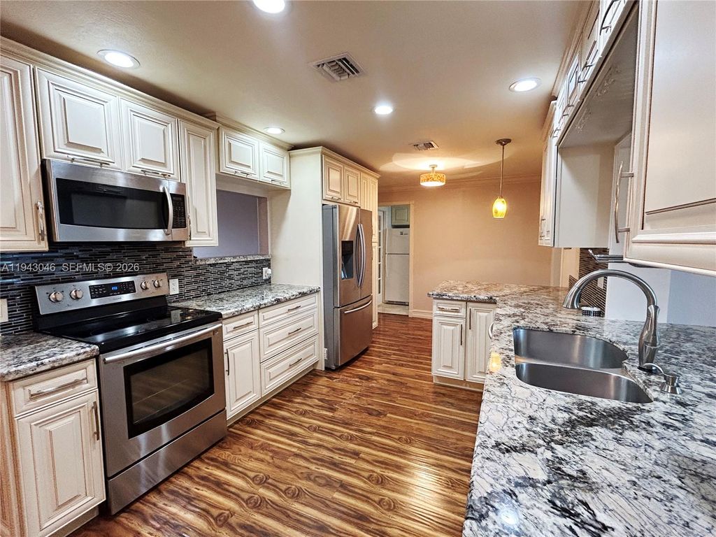 Photo of 4945 NW 55th Ct, Tamarac, FL 33319 (MLS # A11943046)