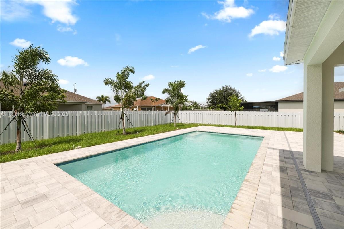 $20,000 BUILDER PAID CLOSING COSTS!! NEW POOL HOME WITH PRIVACY FENCE – THE TIDEWATER! This spacious 4-bedroom, 3-bath home includes TWO PRIMARY SUITES, each with a full ensuite bath and walk-in closet. Enjoy the peace of mind that comes with NO FLOOD ZONE & IMPACT WINDOWS, meaning lower insurance costs and greater security! Whether you’re entertaining or relaxing, this outdoor space is designed for year-round enjoyment! At the heart of the home is a gourmet kitchen, featuring stainless steel appliances, all-wood, soft-close cabinetry, quartz countertops, a large island with breakfast bar, and a spacious pantry. The wide-open living areas boast vaulted ceilings and luxury hard surface flooring throughout. Each bedroom comes with a ceiling fan for added comfort. This is The Tidewater Plan.