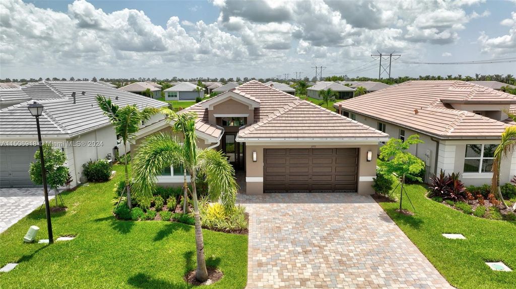 Photo of 11933 SW Coral Cove Pkwy, Port Saint Lucie, FL 34987 (MLS # A11506918)