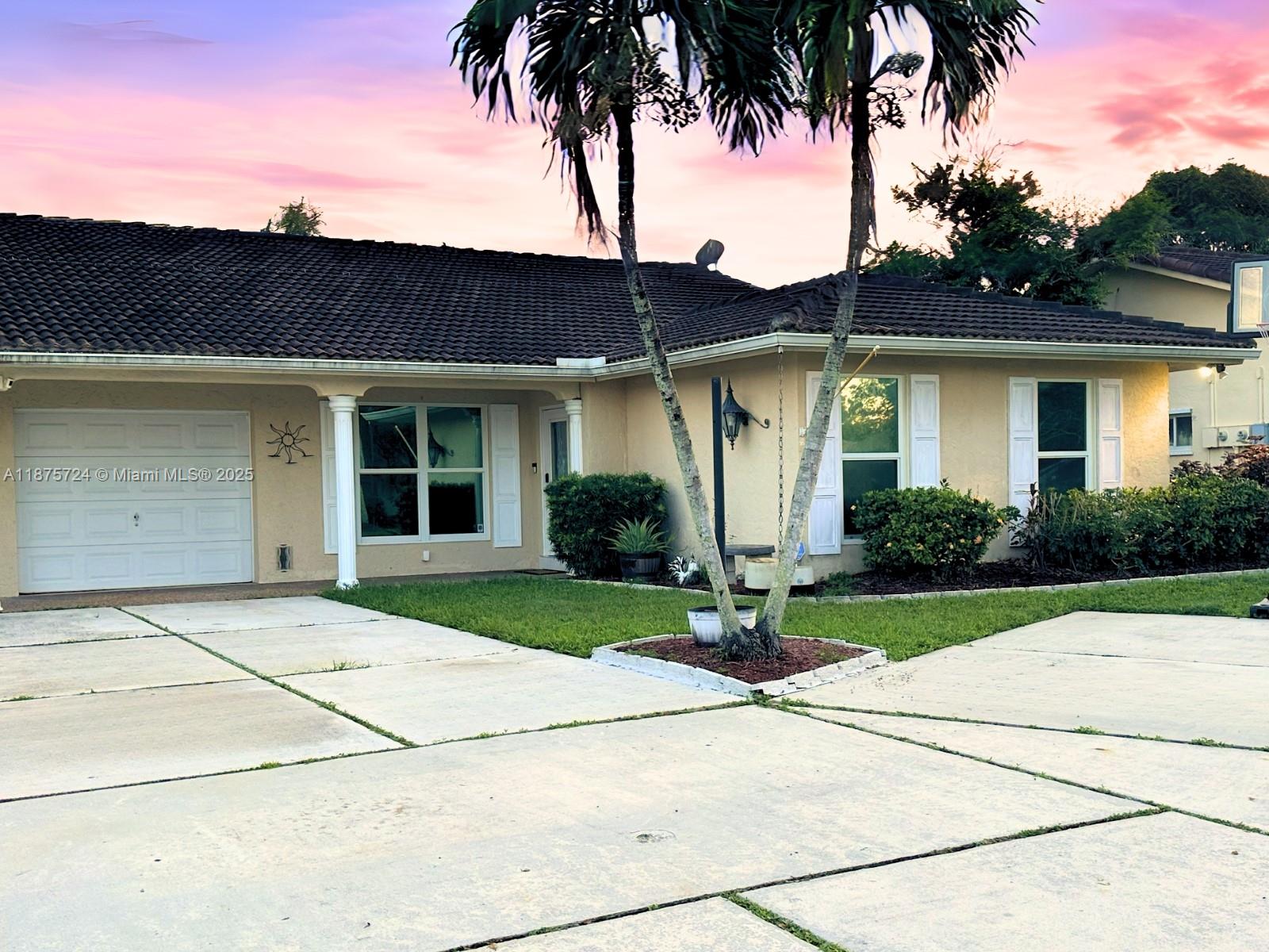 In the desirable Coral Springs Country Club West, this 1,821 sq. ft. attached Duplex home offers 3 bedrooms, 2 bathrooms, and a 1-car garage with an open-concept layout connecting the family, dining, and kitchen areas. The wrap-around kitchen features KitchenAid stainless steel appliances, granite countertops, and ample cabinet space, while a screened sunroom and family room showcase tranquil water views. The king-sized primary suite includes a full ensuite bath, with spacious secondary bedrooms and a formal living area providing additional flexibility. Recent upgrades include IMPACT WINDOWS & DOORS, S-tile roof, and 2022 HVAC. Flood Zone X and no HOA makes this an affordable and attractive Coral Springs opportunity close to top schools, shopping, dining, and major roadways.