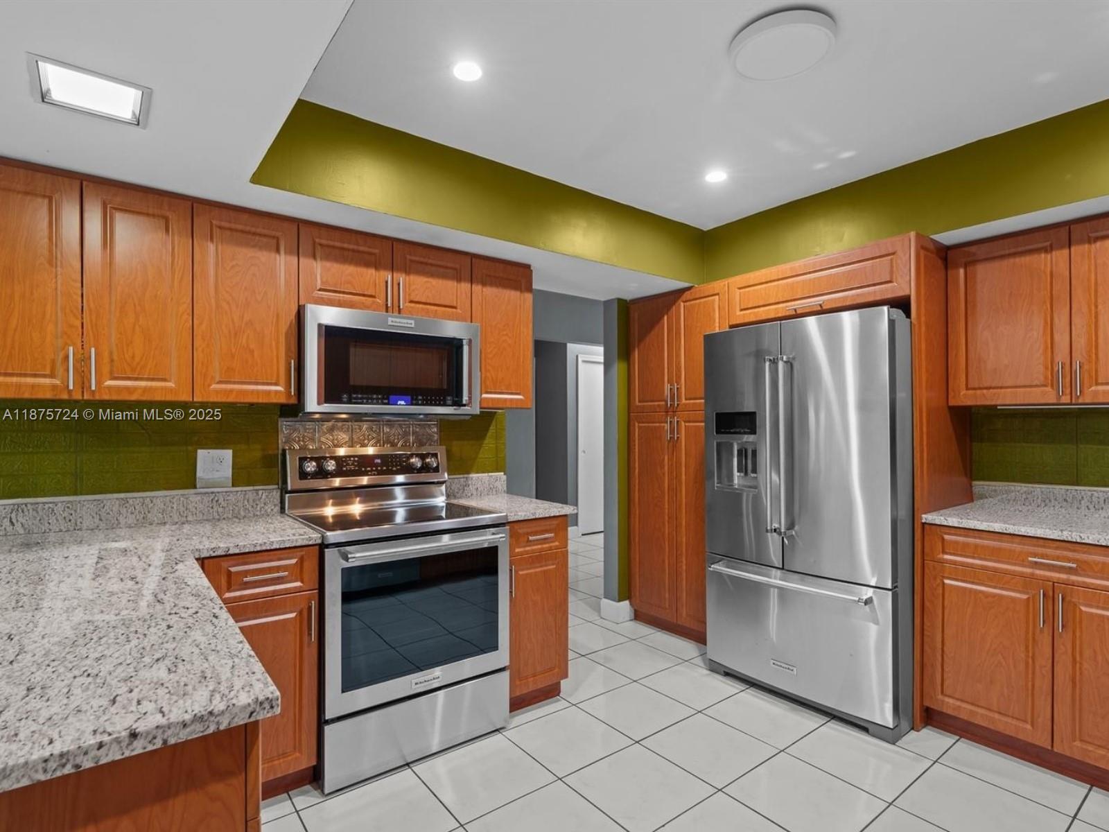 In the desirable Coral Springs Country Club West, this 1,821 sq. ft. attached Duplex home offers 3 bedrooms, 2 bathrooms, and a 1-car garage with an open-concept layout connecting the family, dining, and kitchen areas. The wrap-around kitchen features KitchenAid stainless steel appliances, granite countertops, and ample cabinet space, while a screened sunroom and family room showcase tranquil water views. The king-sized primary suite includes a full ensuite bath, with spacious secondary bedrooms and a formal living area providing additional flexibility. Recent upgrades include impact windows and doors, S-tile roof, and 2022 HVAC. Flood Zone X and no HOA make this an affordable and attractive Coral Springs opportunity close to top schools, shopping, dining, and major roadways.