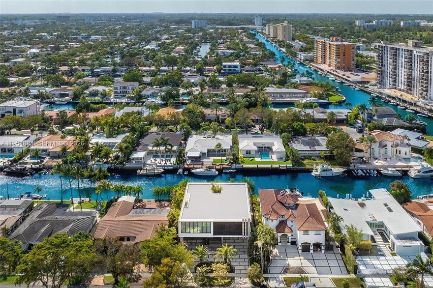 Keystone Island Contemporary Masterpiece of Architecture and Design, perfectly situated in a gated community with 24-hour security—just 5 minutes to high-end restaurants and Bal Harbour Shops. Features 78 ft of waterfront with deep-water dockage, only 3 minutes to the bay. 6 bedrooms / 5 bathrooms, 8,692 total SF, with a pool and spa plus waterfall and fountain. 4-car garage, soaring 24' ceilings, and solid concrete slab construction on the 1st floor, 2nd floor, and roof. Natural gas. Impact and solar-rated protection windows and doors. Natural walnut Italian doors throughout. Italian kitchen with top Wolf and Sub-Zero appliances. Glass interior patio and 2,200 SF of outdoor living space with summer kitchen. Property has been used only as a vacation home. Easy to show.