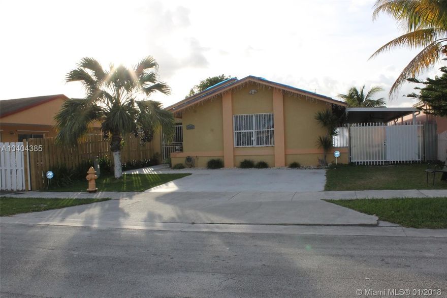 Charming one story home!! This 3/2 is tiled throughout, huge walk-in closets, updated baths and kitchen, with large fenced in backyard and 2 bonus storage rooms. Has ample room for parking and also offers a large covered patio on both the side of the home and the backyard.  New roof to be installed prior to closing, A/c replaced in 2015. Complete Outdoor kitchen for entertaining. Located close to a community park and shopping district. NO HOA.  Easy to show!!