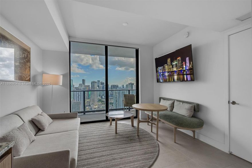 Experience elevated living from the 45rd floor in this fully furnished 1-bedroom residence offering breathtaking city and bay views. Designed for modern comfort, it features an open layout with floor-to-ceiling windows, a sleek European kitchen with quartz countertops, premium appliances, and a private balcony ideal for morning coffee or evening sunsets. Located in one of Miami’s most vibrant Airbnb-friendly towers allowing daily rentals, it’s perfect for personal use or investment. Enjoy resort-style amenities including an infinity pool, spa, rooftop lounge, fitness center, coworking spaces, and 24-hour valet—steps from Miami Worldcenter, Brightline, Kaseya Center, and Brickell nightlife.