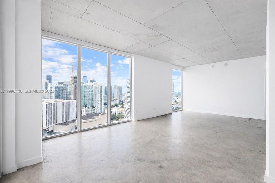 Corner loft-style 2BR/2BA residence in the heart of Downtown Miami, just minutes from Brickell. Enjoy city and Biscayne Bay views from floor-to-ceiling windows, with soaring ceilings, polished concrete floors, and a modern kitchen with in-unit washer and dryer. Located near top dining, shopping, and entertainment. Centro offers premium amenities including a rooftop pool with panoramic views, fitness center, media lounge with coffee bar, jacuzzi, sauna, and 24-hour concierge and valet. Short-term rentals permitted (30-day minimum).